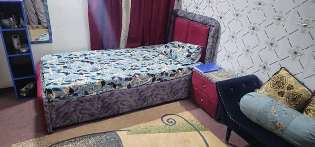 Single bed with side table and metres