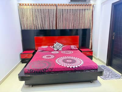 Master Bed with 2 site tables without mattress.