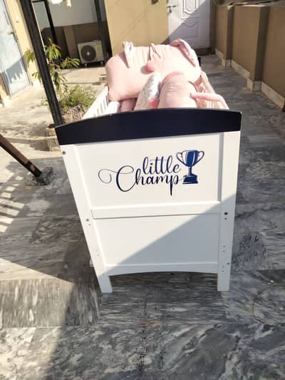 Baby cot with matters and decorative assessories