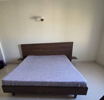 Bed with side table