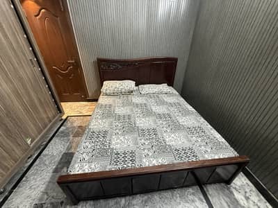 IT IS A DOUBLE BED FOR TWO PERSONS WITH SIDE TABLES