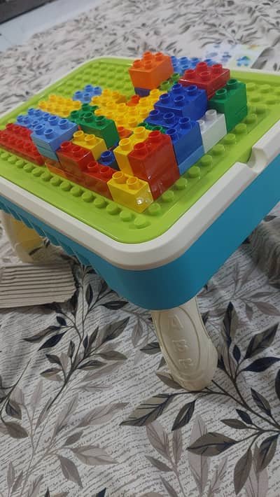 Its a creative 3 in 1 building block table
