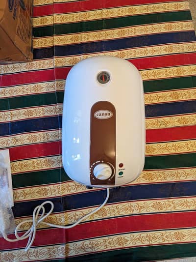 Canon Instant Geyser + Automatic Water Pump for sale