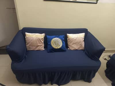 7 seater sofa set with free covers, and 5 seater sofa set.