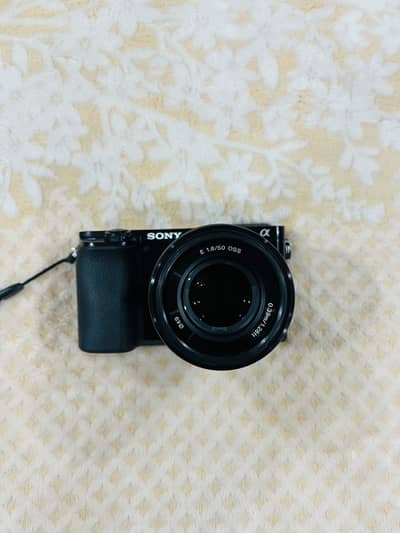 Sony A6100 Mirrorless Camera + Kit Lens + 50mm 1.8 OSS Lens + Flash