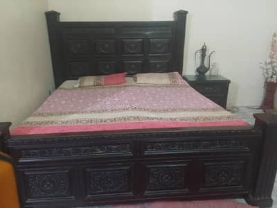 wooden bed with spring mattress