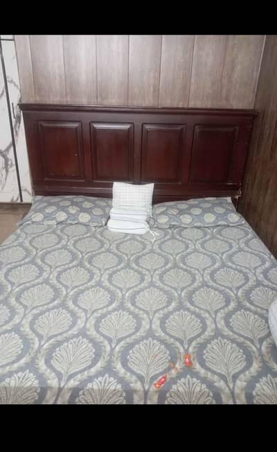 king size bed without mattress and side table