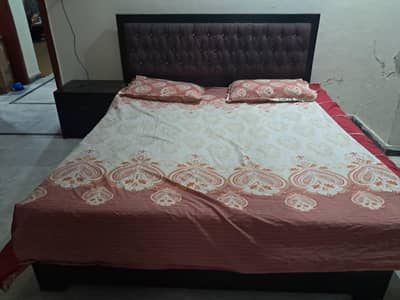 double bed with one side table