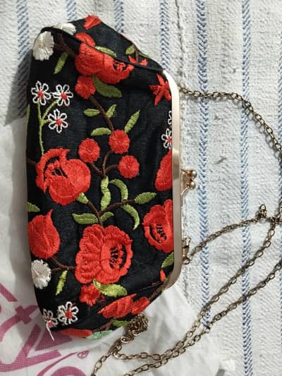 Stylo embroided clutch