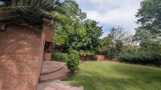 CORNER 2 KANAL(1 KANAL CONSTRUCTION+1 KANAL LAWN) OWNER BUILT ELEGANT AND FULLY MAINTAINED SUPER HOT LOCATED BUNGALOW IS AVAILABLE IN THE BEST BLOCK OF DHA LAHORE NEAR DHA CLUB.