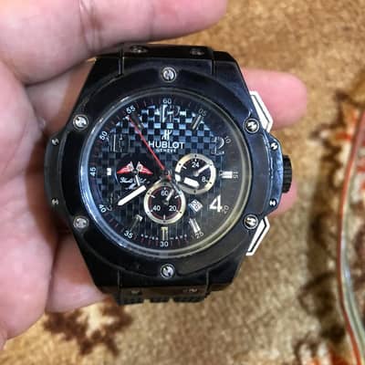 Black Hublot watch chronograph working