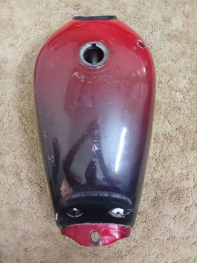 Honda CD 70 fuel tank. Red and black wrap, no leakage, good condition.