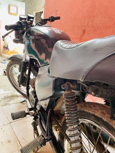 sp 100 cafe racer