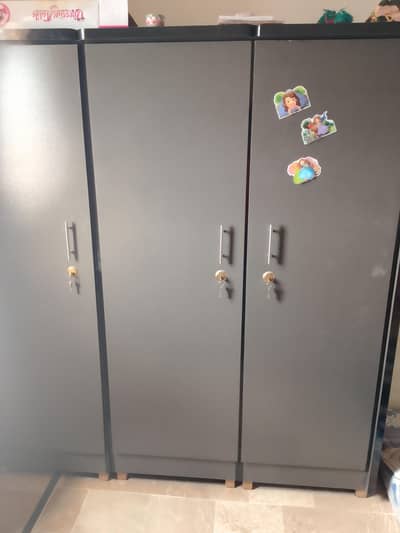 urgent sell. . .  3 door Almari/cabinet black and gray