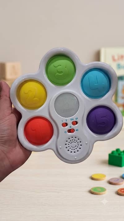 Chuckle & Roar Pop It! & Learn educational electronic toy,