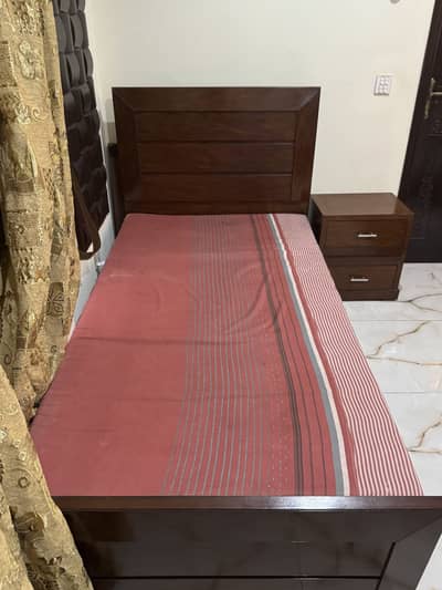 Single bed with side table