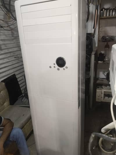 2 tan Gree floor standing ac heat and cool