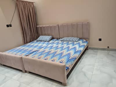 Two single beds without mattress , royal orchard