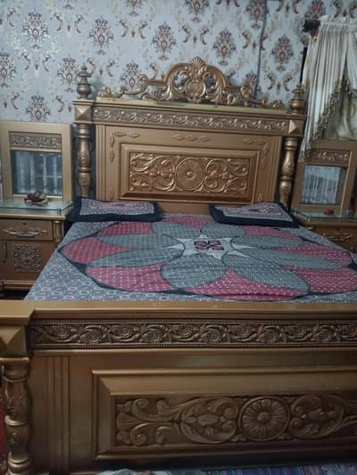 king  size bed with mirrors and lights side tables