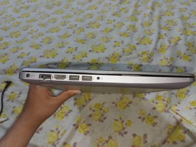 This stylish HP laptop features a premium silver finish with