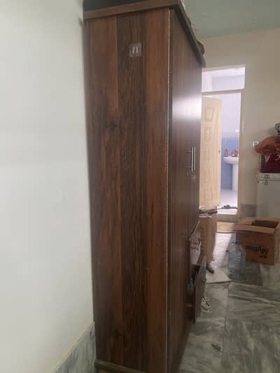 Wooden Wardrobe with Multiple Storage Drawers. ”