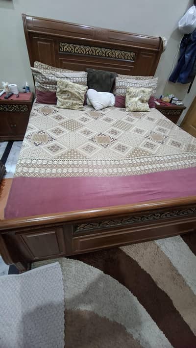 bed with side tables and dressing table