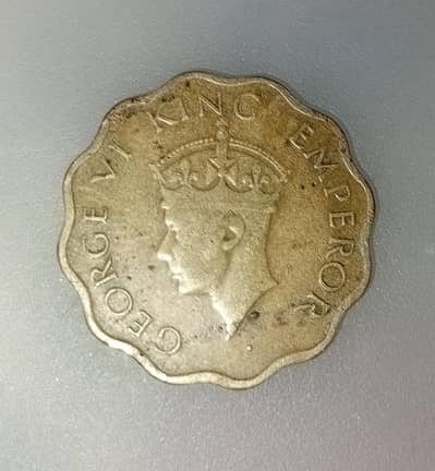 One Anna Indian coin .