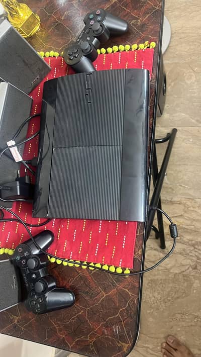 PS3 with 10gaming cds and 3 controllers