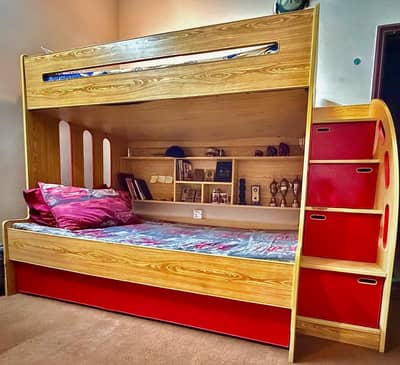 A bunk bed with study table's and chairs are for sale.