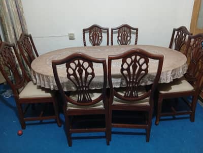 dinning table in Very good condition pure wooden with 8 chair's