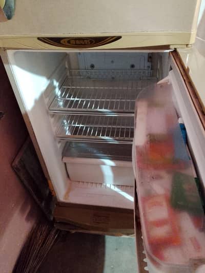 waves fridge for sale urgently plz first owner full & finely price 35k