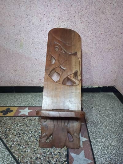 2 African wood chairs .