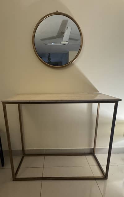 Metal console with Marble top and round metal mirror.
