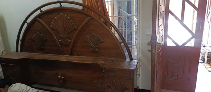 bed with dressing and sofa table