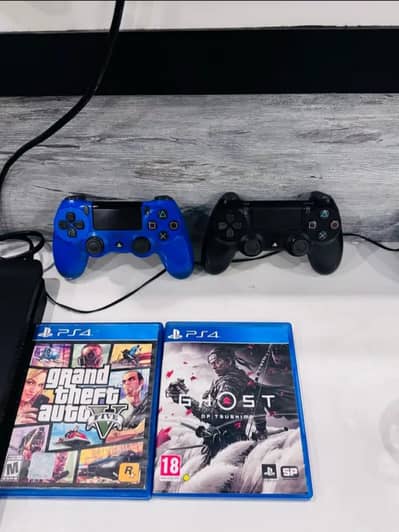 PS4 slim with 2 original controllers and 2 CDs for sale