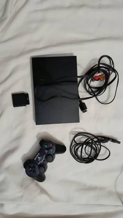 PS2 WITH 2 CD'S