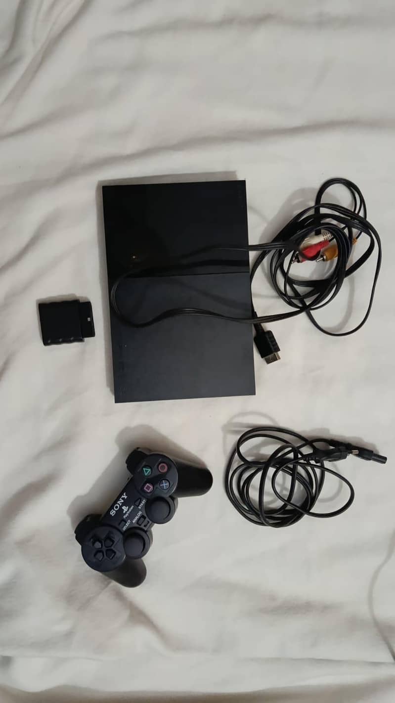 PS2 WITH 2 CD'S 0