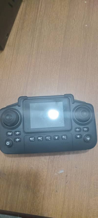 Drone with adjustable cameras, remote with screen and carry case