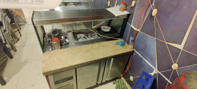 Under counter chiller plus salad bar.