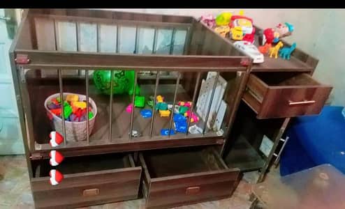 baby cot with four drawers and 6 wheelers loveable good condition