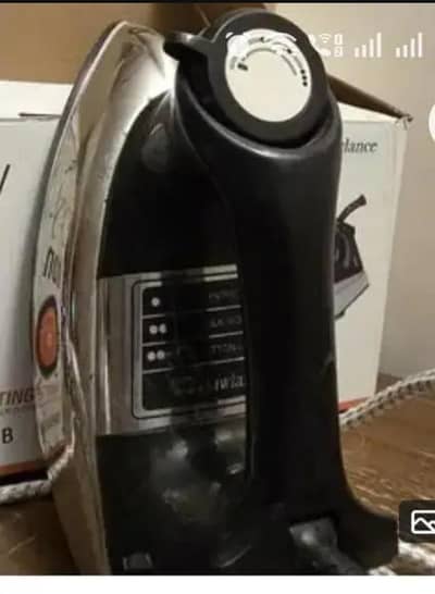 Great condition.  Black and silver coloured iron with box sale