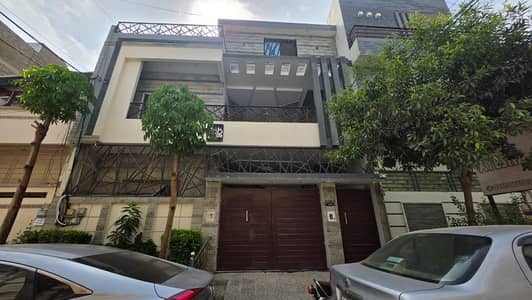 200 Yards beutiful 7 bed rooms modern built amd design.