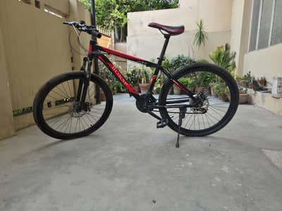 26-inch Japanese Mountain Bike With shocks and gears.