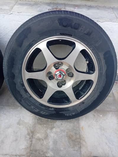 beautiful light weight 6 spokes rims 14" with Yokohama tyres