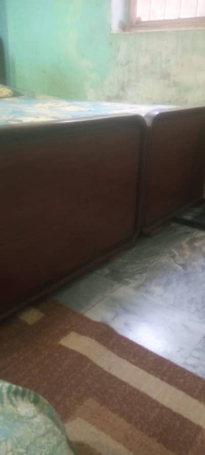 Pair of single wooden bed