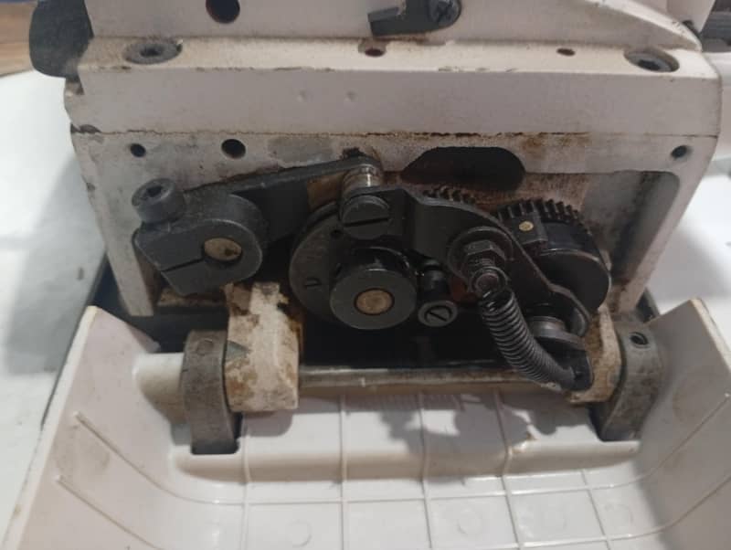 button attaching machine 2