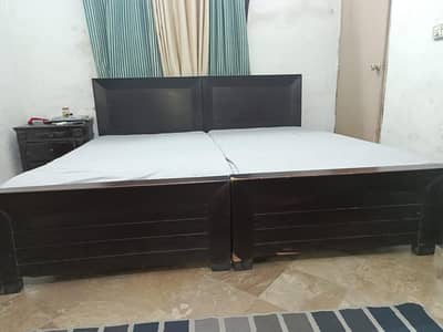 2 single beds with mattresses