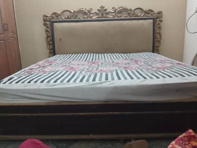 brown wooden bed
