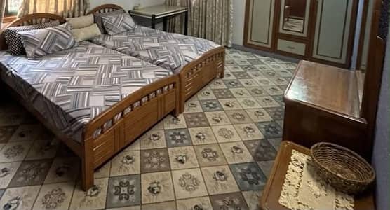 2 single beds(mattresses included), side and dressing table