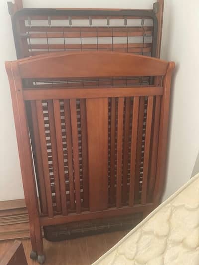 Large wooden baby cot by Zubair as